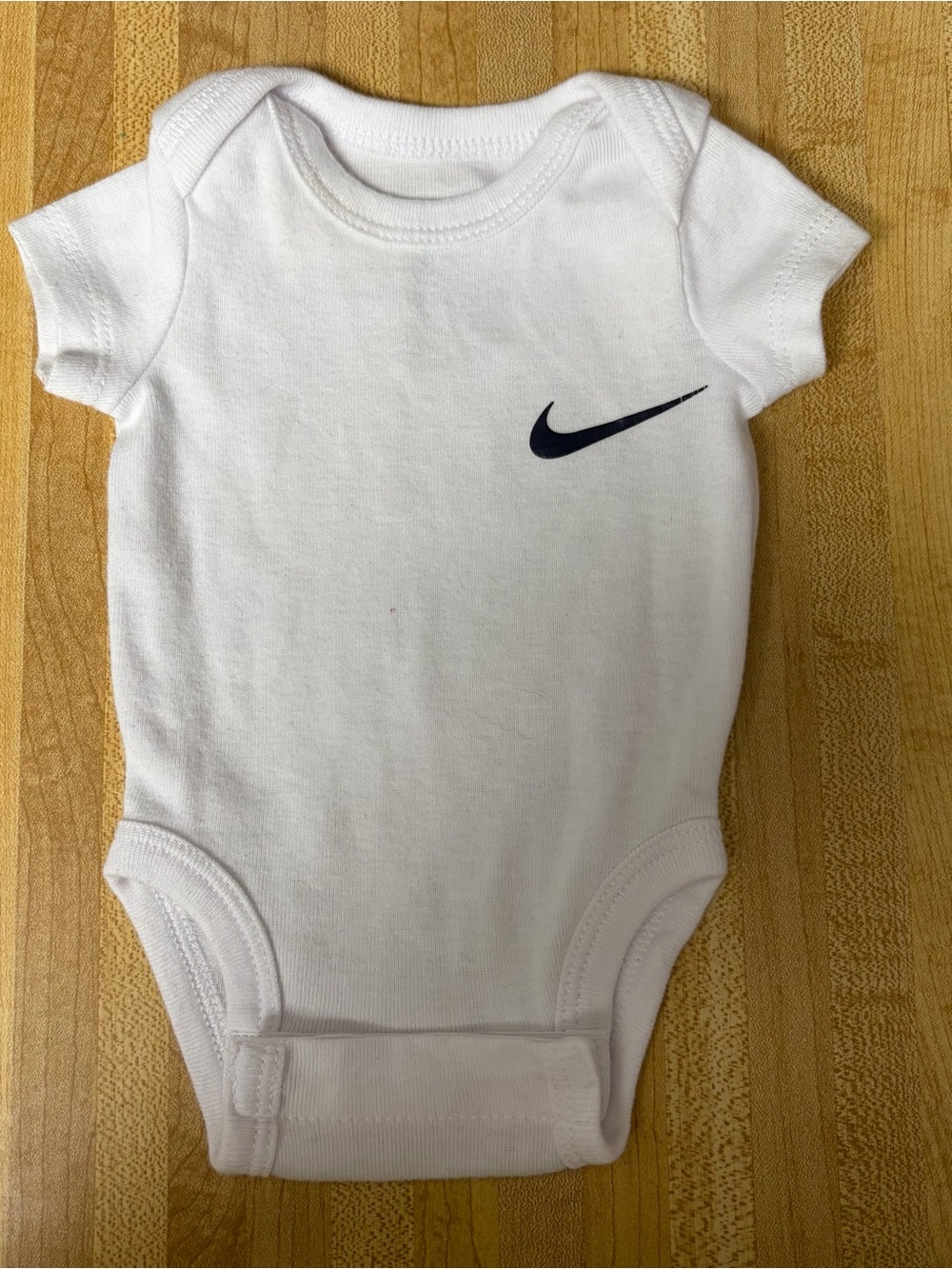 Nike White Baby Bodysuit with Navy Swoosh